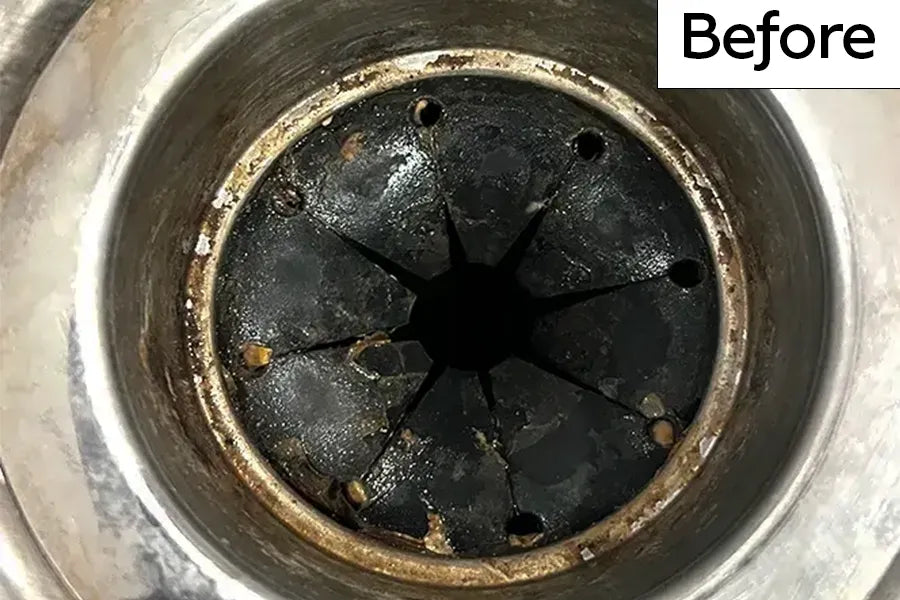 Kitchen sink garbage disposal drain with rubber splash guard that has sticky gunk and debris and is labeled 'Before'.